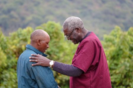 Dr. Mandieka Engages in Prayer with Maasai Man Embracing Christianity