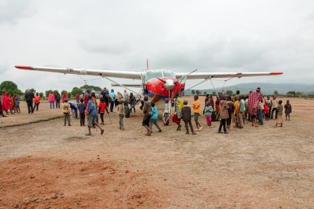Kids excited about the MAF plane landing in Enairebuk.